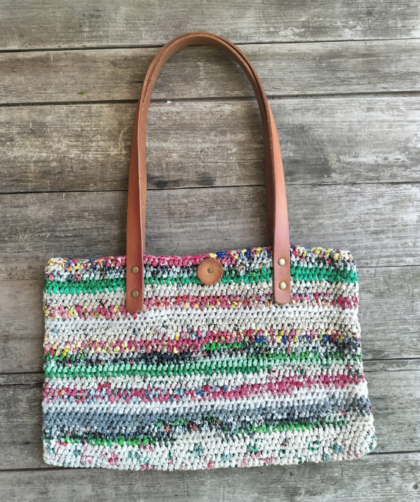 Multicoloured upcycled plastic handbag with tan leather handles